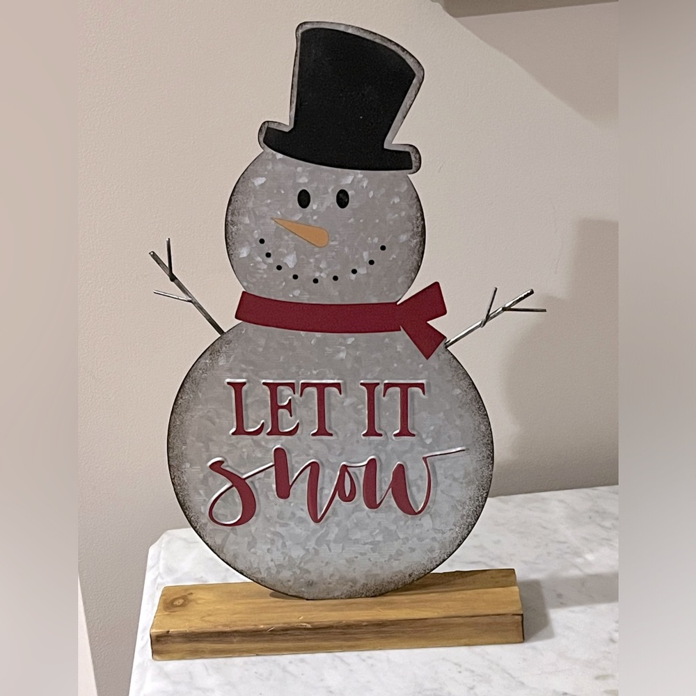 Tin snowman Christmas decoration.
